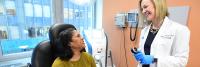 dermatologist talking to patient